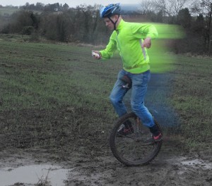 Unicycling while reading a mobile phone